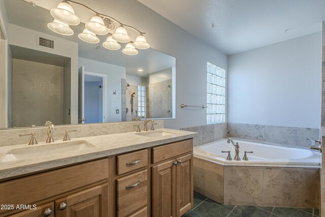 2340 W Myrtle Dr, Chandler, AZ 85248 - full bath featuring a garden tub, double vanity, tiled shower, and tile patterned flooring