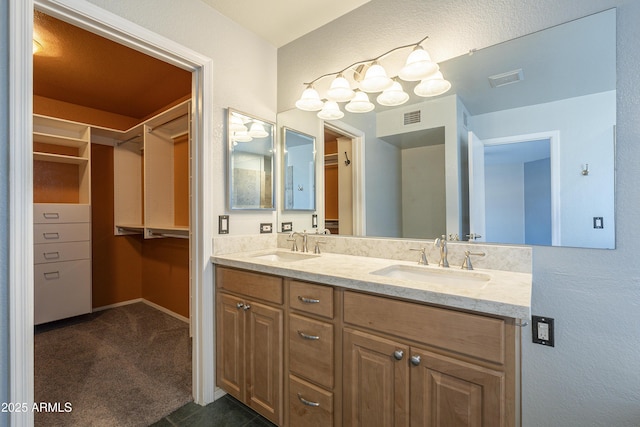 2340 W Myrtle Dr, Chandler, AZ 85248 - bathroom featuring double vanity and a spacious closet