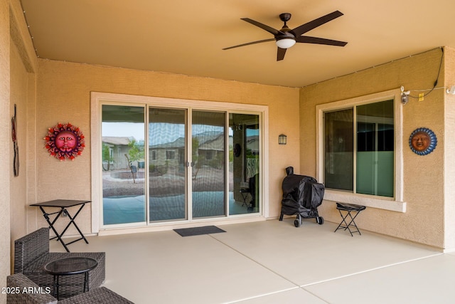 view of patio featuring a ceiling fan