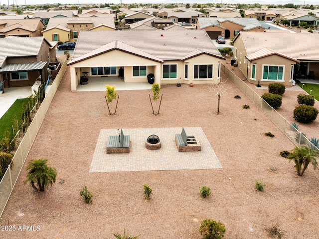 view of front of property with a residential view, a patio area, and a fire pit