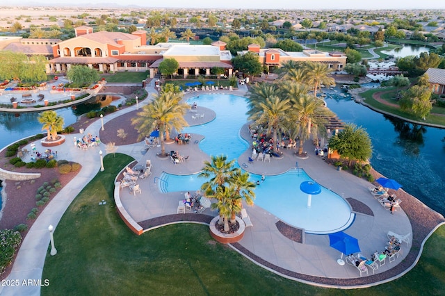 birds eye view of property featuring a water view