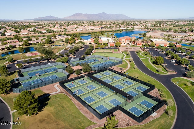 drone / aerial view with a residential view and a water and mountain view