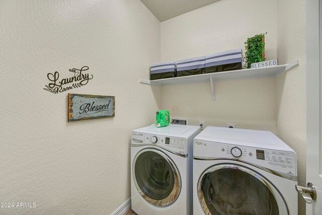 clothes washing area with independent washer and dryer