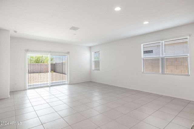 unfurnished room featuring recessed lighting, visible vents, plenty of natural light, and light tile patterned floors