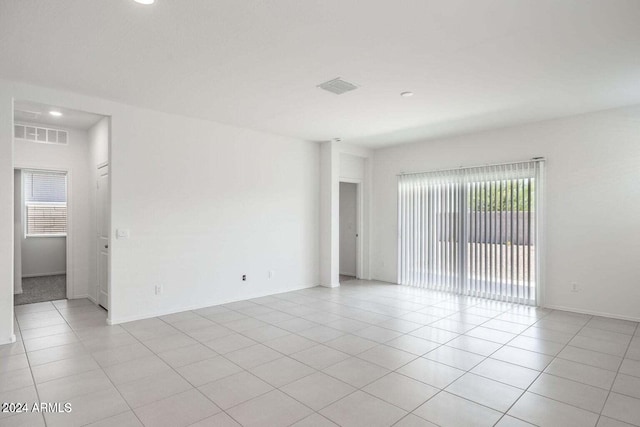 empty room featuring visible vents, recessed lighting, baseboards, and light tile patterned floors