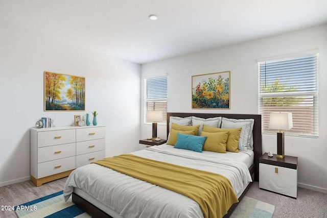 bedroom with baseboards and multiple windows