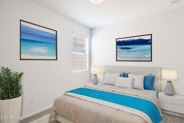 carpeted bedroom with baseboards