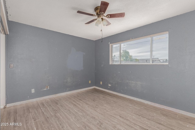 unfurnished room featuring ceiling fan, a textured ceiling, and light hardwood / wood-style floors