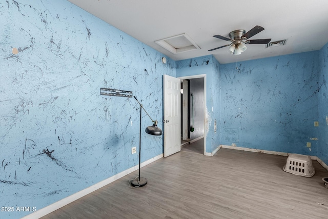 spare room featuring wood-type flooring