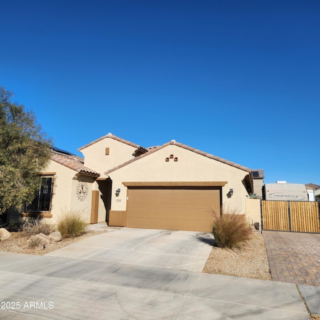 mediterranean / spanish-style home featuring a garage