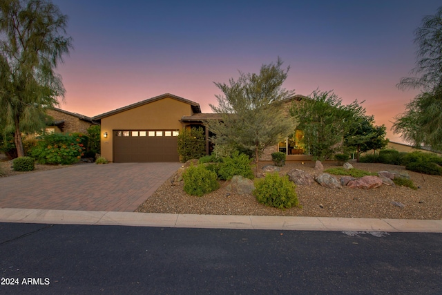 3361 Josey Wales Way, Wickenburg, AZ 85390 - view of front of property featuring stucco siding, decorative driveway, and a garage