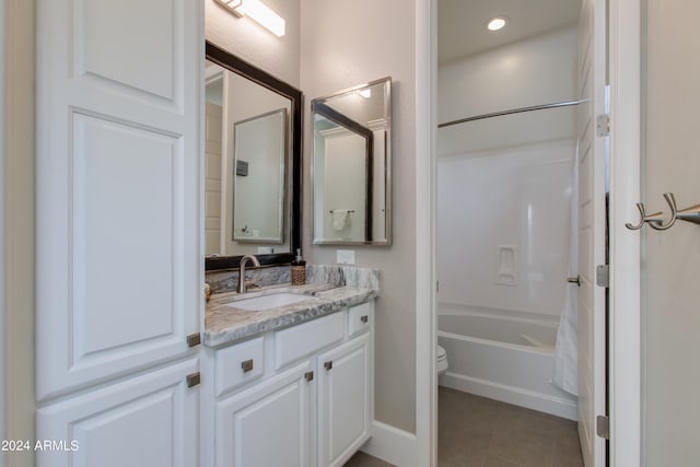 full bathroom with tile patterned flooring, shower / washtub combination, vanity, and toilet