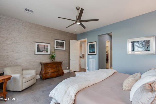 bedroom featuring connected bathroom and ceiling fan