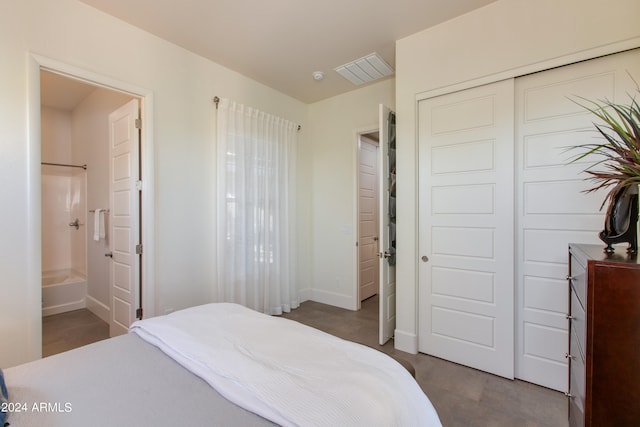 bedroom featuring a closet and ensuite bathroom