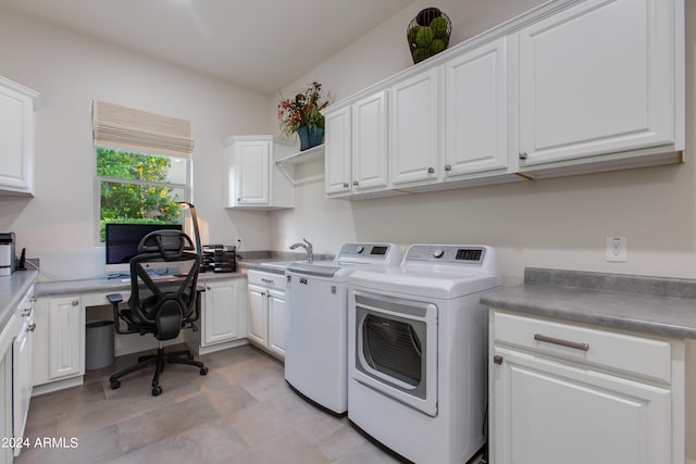 laundry room featuring cabinets, separate washer and dryer, and sink