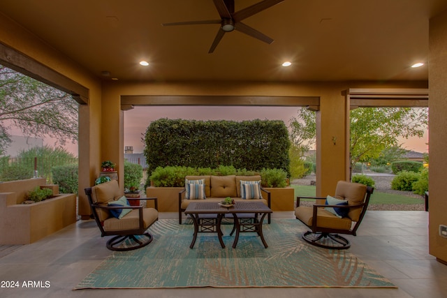 sunroom featuring ceiling fan