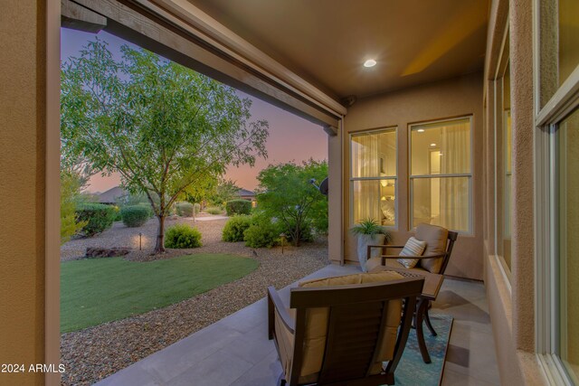 patio terrace at dusk with a yard