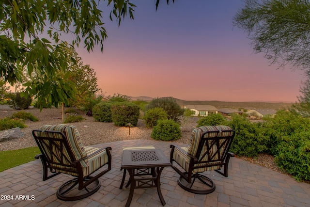 view of patio terrace at dusk