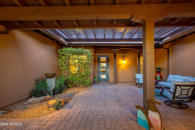 property entrance featuring a patio area