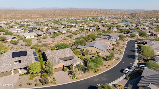 birds eye view of property featuring a mountain view