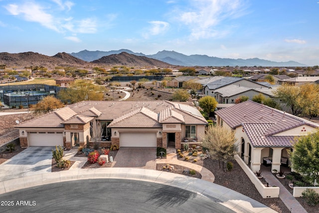 exterior space featuring a garage and a mountain view