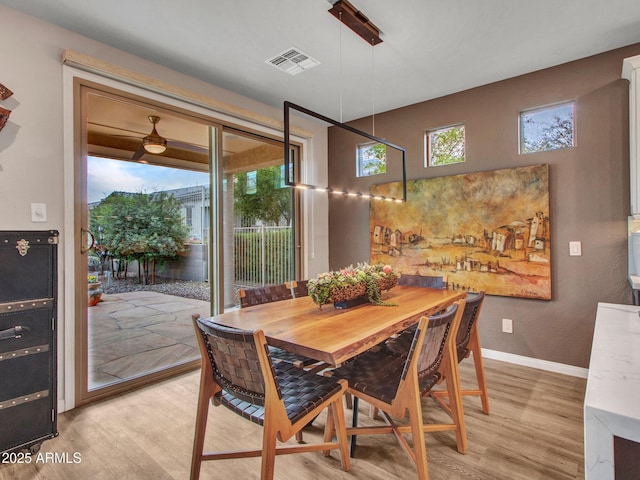 dining area with light wood-type flooring