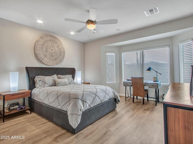 bedroom with ceiling fan and light wood-type flooring