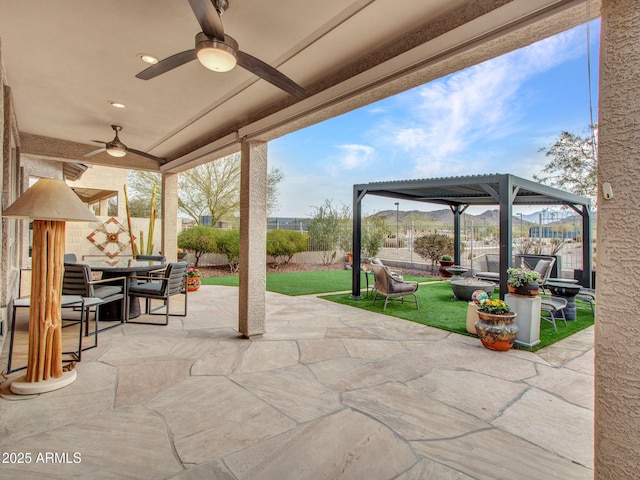 view of patio featuring a pergola and ceiling fan