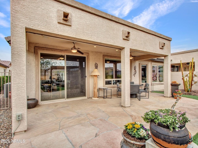 view of patio featuring ceiling fan