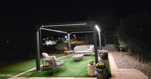 patio at twilight featuring a yard and a pergola