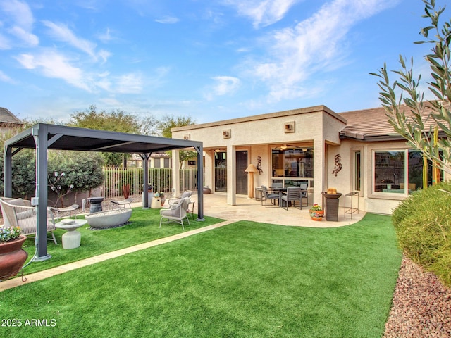 back of house featuring a patio and a lawn