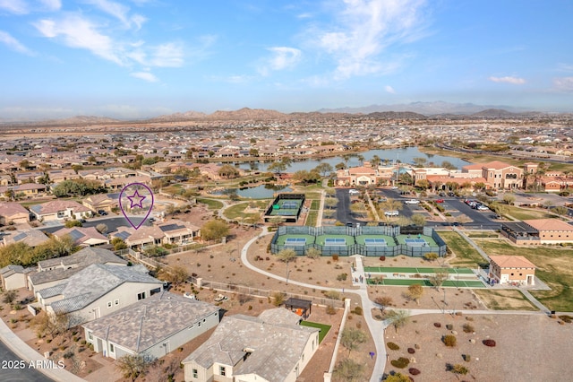 drone / aerial view with a water and mountain view