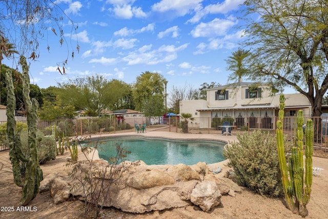 view of swimming pool with fence, a patio area, and a fenced in pool