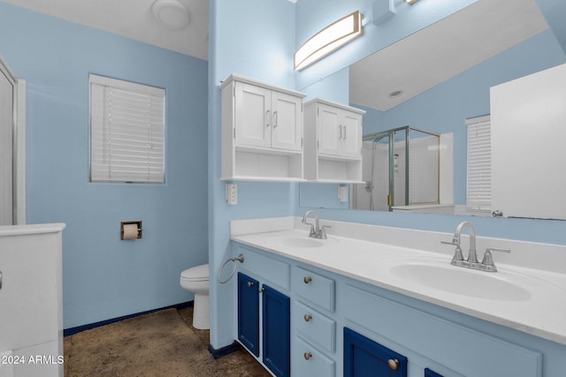 bathroom with walk in shower, vanity, and toilet