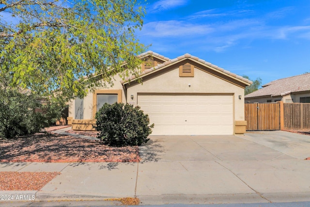 ranch-style home featuring a garage