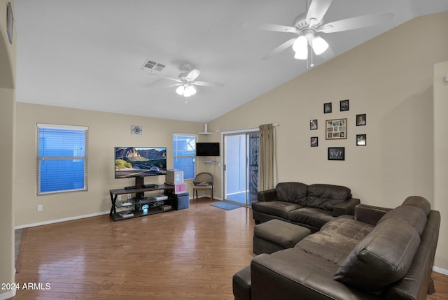 living room featuring lofted ceiling, hardwood / wood-style flooring, and ceiling fan