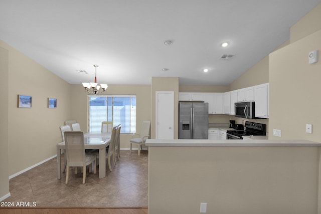 kitchen with stainless steel appliances, white cabinetry, light hardwood / wood-style floors, kitchen peninsula, and lofted ceiling