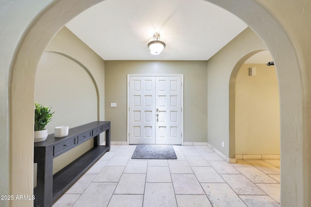 6911 E Thunderbird Rd, Scottsdale, AZ 85254 - foyer entrance with arched walkways and baseboards