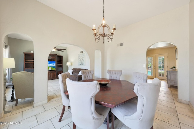 6911 E Thunderbird Rd, Scottsdale, AZ 85254 - dining space with a towering ceiling, a chandelier, light tile patterned floors, arched walkways, and a ceiling fan