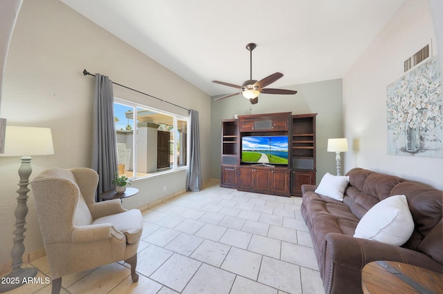 6911 E Thunderbird Rd, Scottsdale, AZ 85254 - living room featuring a ceiling fan and vaulted ceiling