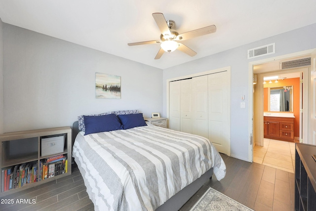 6911 E Thunderbird Rd, Scottsdale, AZ 85254 - bedroom with wood finished floors, a closet, and a ceiling fan