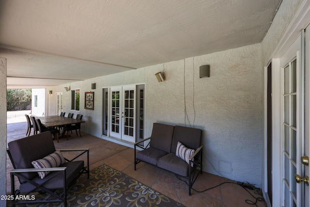 6911 E Thunderbird Rd, Scottsdale, AZ 85254 - view of patio / terrace featuring french doors and outdoor dining area