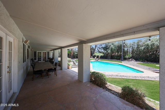 6911 E Thunderbird Rd, Scottsdale, AZ 85254 - outdoor pool with french doors and a patio area