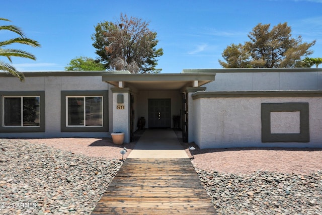6911 E Thunderbird Rd, Scottsdale, AZ 85254 - view of exterior entry with stucco siding