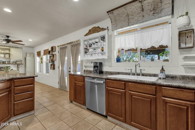 kitchen featuring dishwasher, ceiling fan, sink, and a wealth of natural light