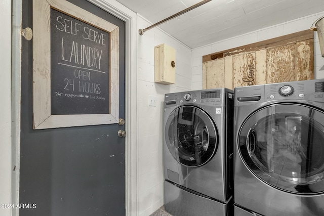 washroom with washer and dryer