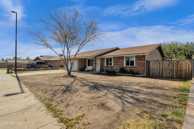 ranch-style home featuring a garage