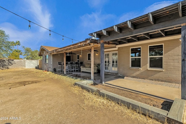 rear view of house featuring french doors and a patio