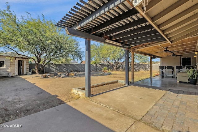 view of patio with an outbuilding and ceiling fan