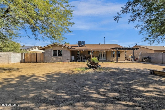 rear view of property featuring central AC unit